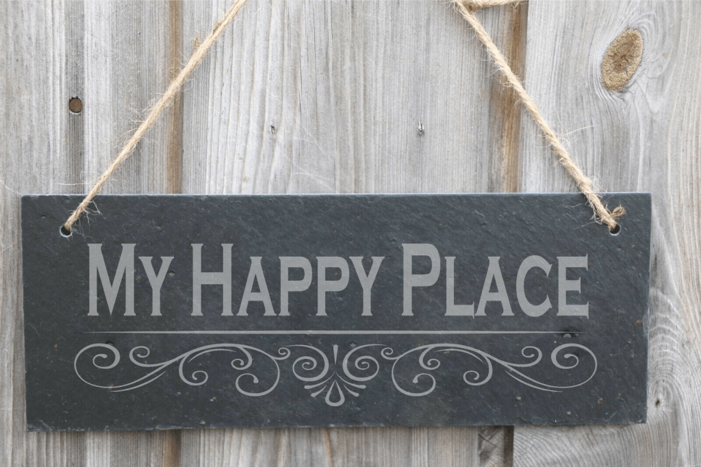 A slate plaque engraved with the words "My Happy Place"